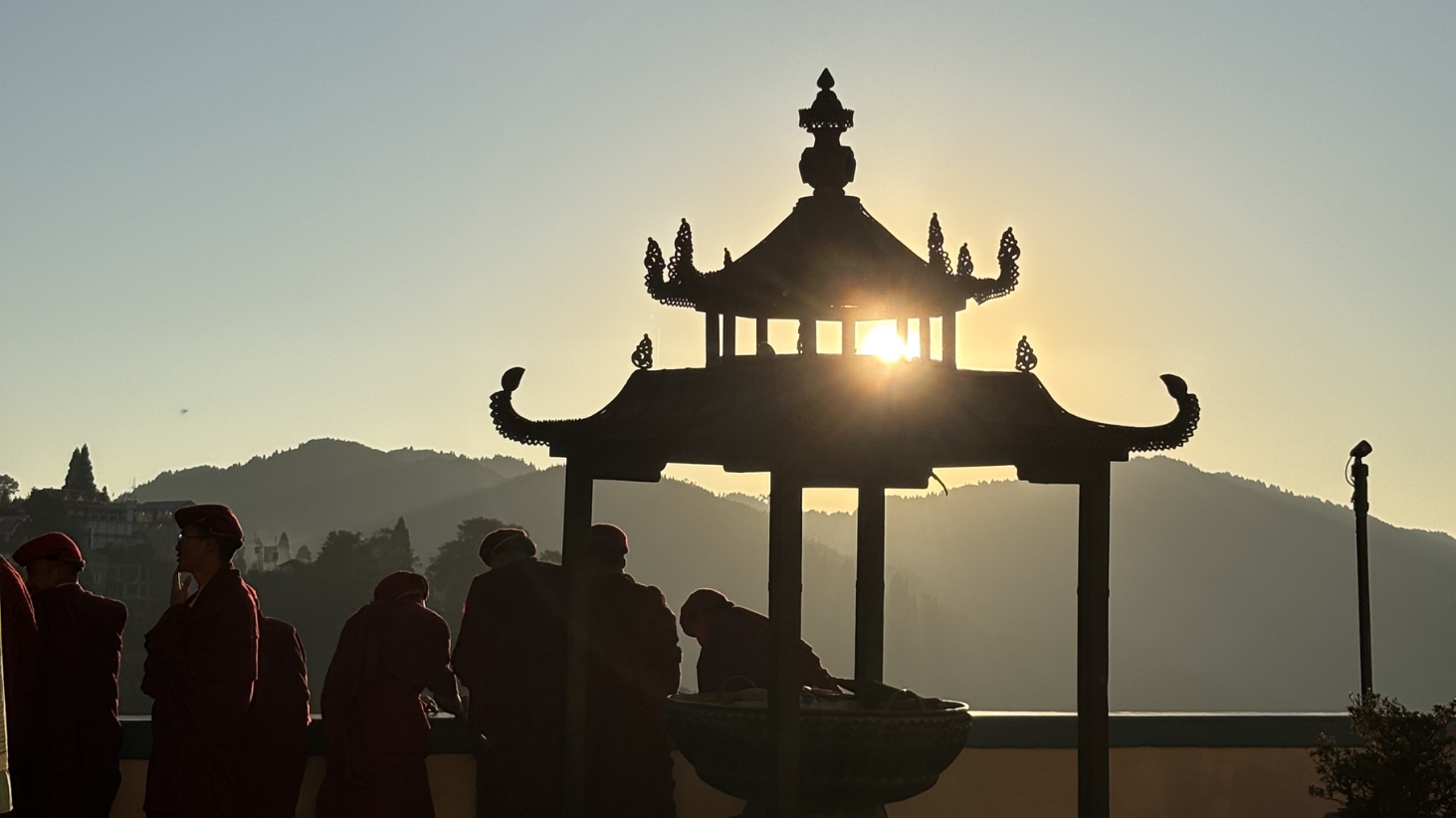 <p>Sunrise filters through the pagoda at the Dali Monastery.</p>