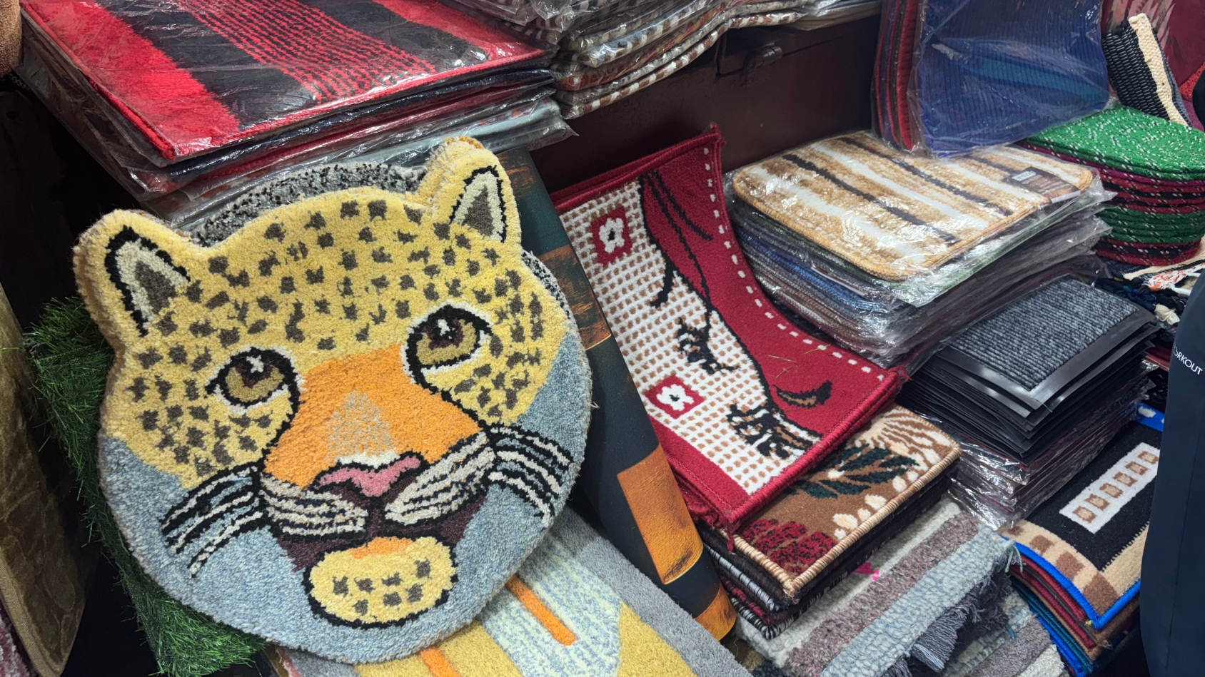 <p>A bold, leopard-shaped rug adds a touch of wildlife-inspired charm to this collection of mats.</p>