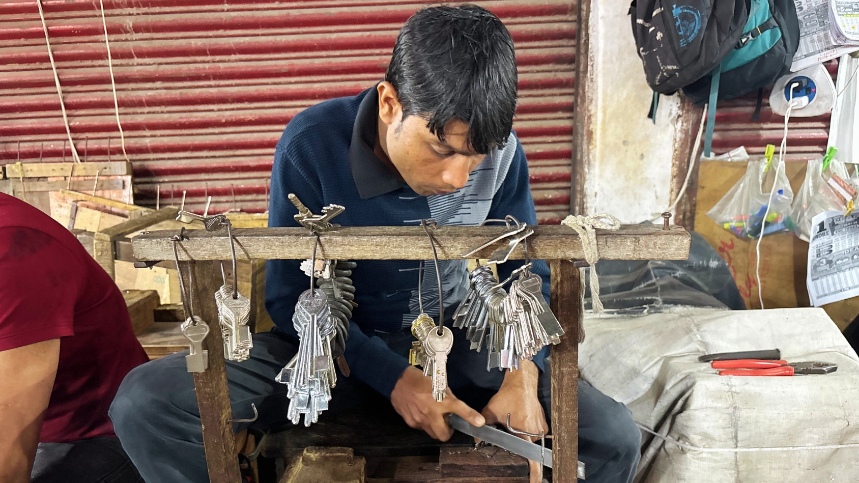 <p>A local locksmith focuses intently on the craft of hand-filing a custom key.</p>
