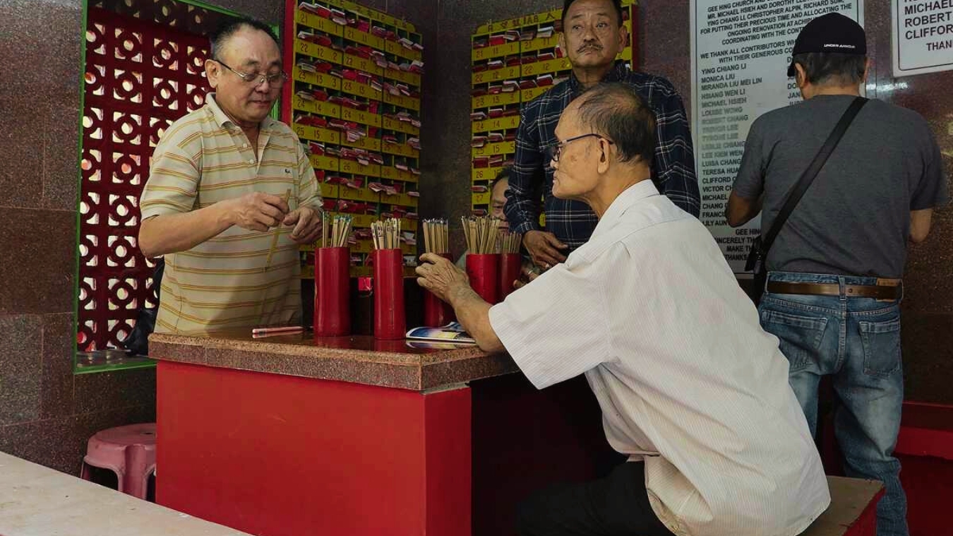 <p>Devotees practicing kau cim, the ancient art of fortune-telling.</p><p> </p>