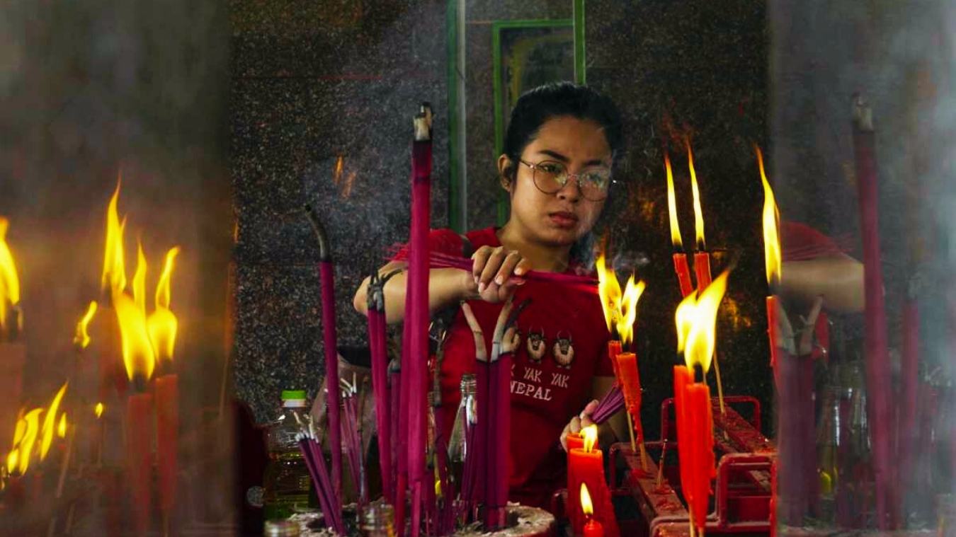 <p>Chinese devotees lighting incense sticks during their visit to the Achipur Chinese Temple. </p><p> </p>