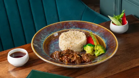 Sliced mutton in nolen gur and rum